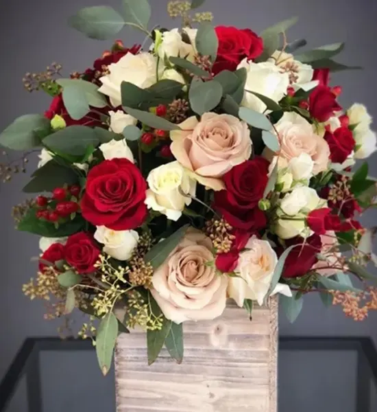 Mix Of Roses Arrangement In A Wooden Vase