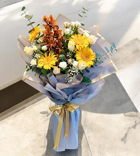 Elegant Peach Roses, Yellow Gerberas & Brown Cymbidium Bouquet